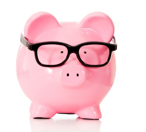 Geeky piggybank with glasses - isolated over a white background