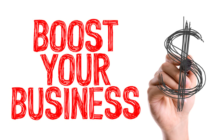Hand with marker writing Boost Your Business