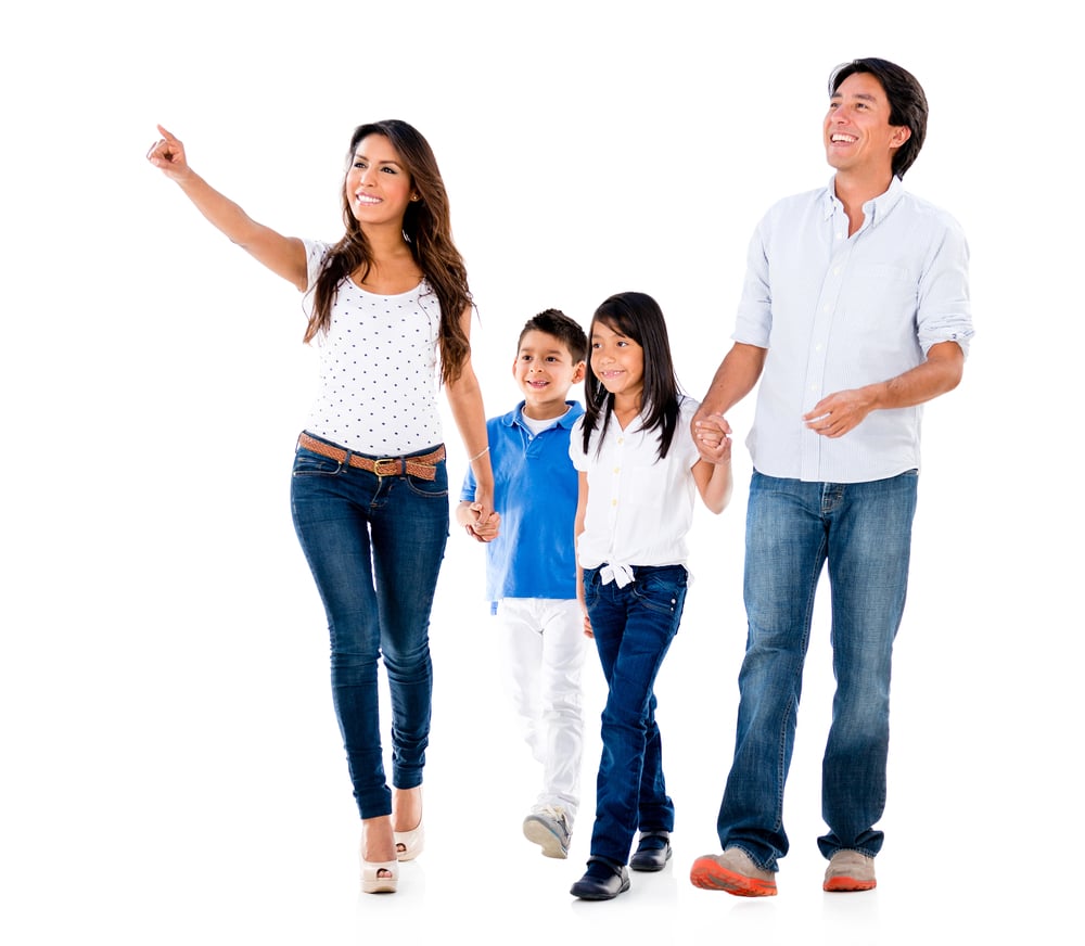 Happy family walking an pointing away - isolated over white background